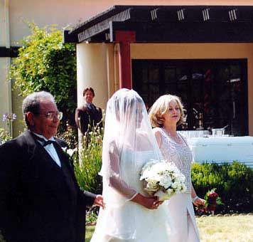 ...escorted by her mother & father